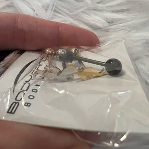 Dinosaur tongue rings. Rose gold, gold, black, and silver.